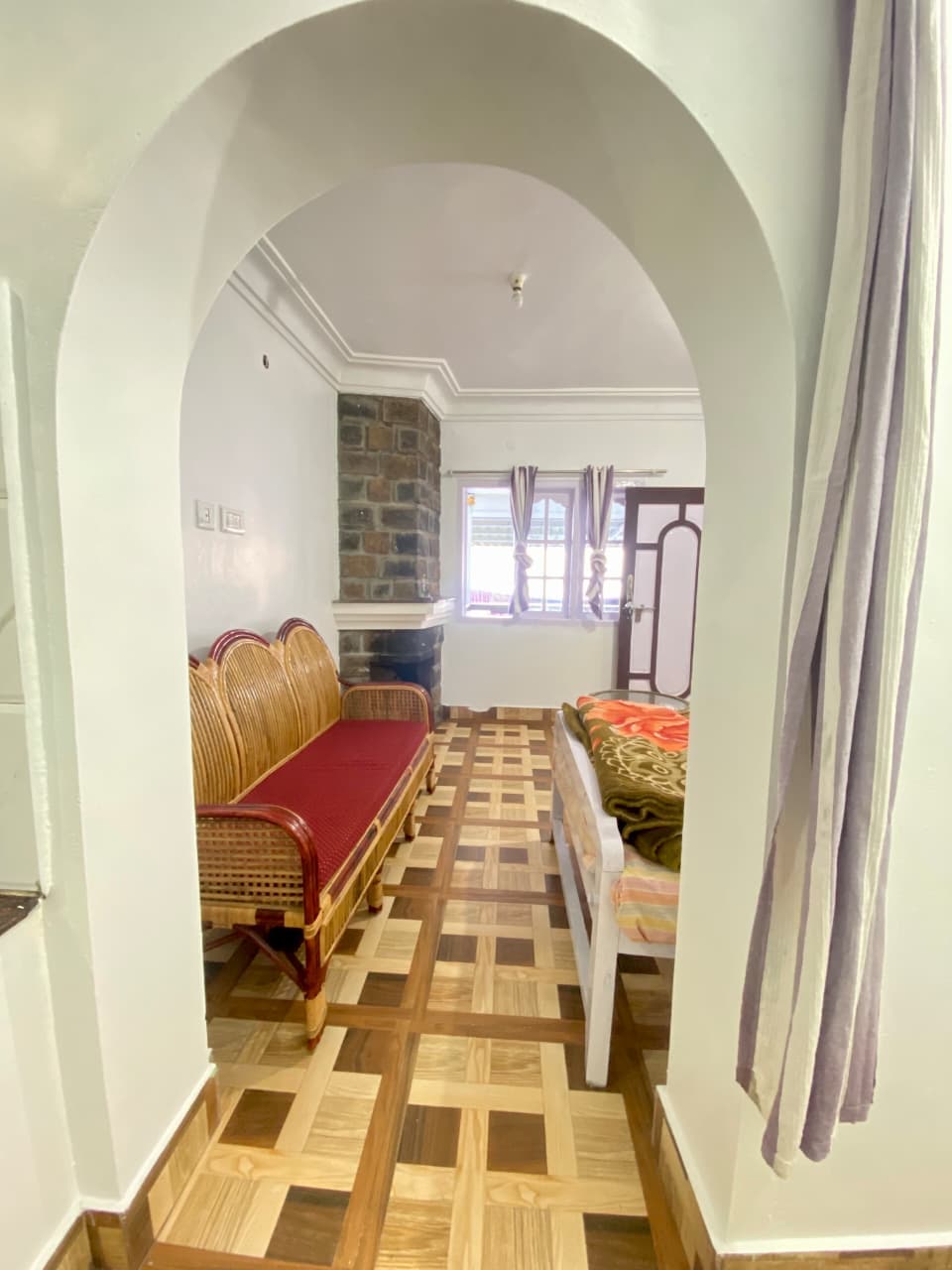 Suite — arched sitting area with stone chimney